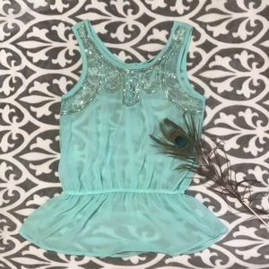 Sheer beaded peplum top